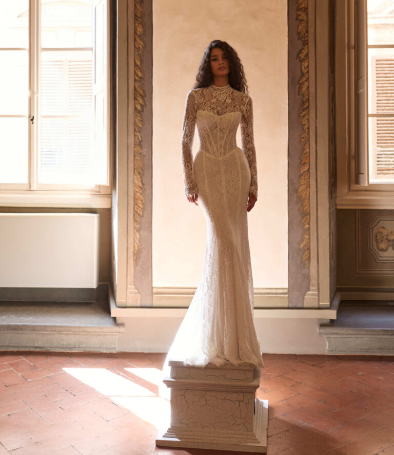 Arvenna by Milla Nova Fitted lace wedding dress that can be worn strapless with optional highneck jacket or long pulling sleeves at Wedding Belles of Four Oaks