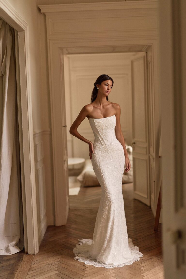 Evolis by Lorenzo Rossi by Milla Nova at Wedding Belles of Four Oaks. Fitted Embellished Wedding dress with detachable bow detail and optional pleated waist skirt