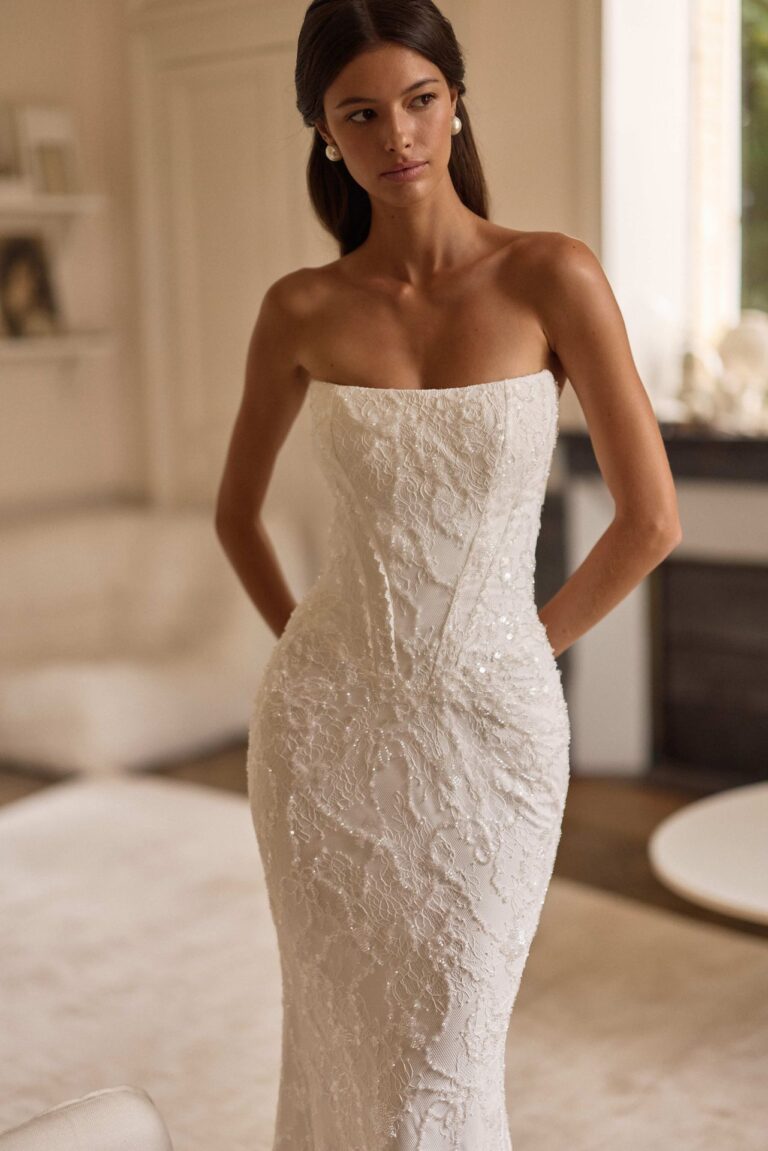 Evolis by Lorenzo Rossi by Milla Nova at Wedding Belles of Four Oaks. Fitted Embellished Wedding dress with detachable bow detail and optional pleated waist skirt