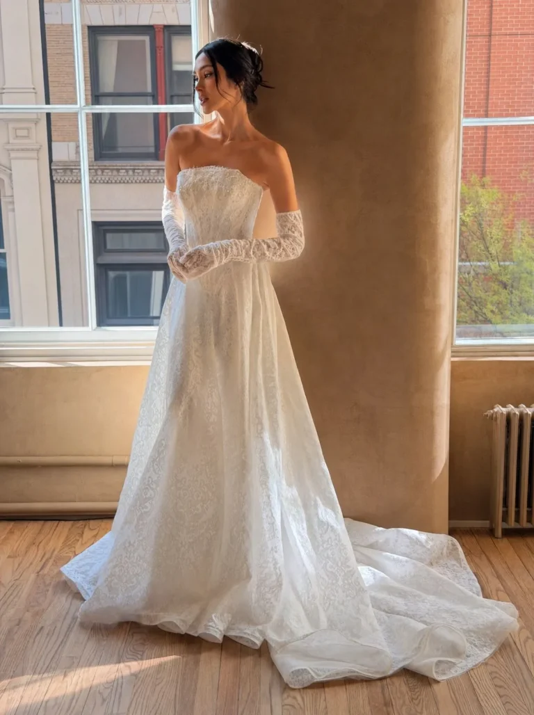 Milla nova Amalia is a dropped basque waist Aline lace wedding dress in chantilly lace with matching gloves