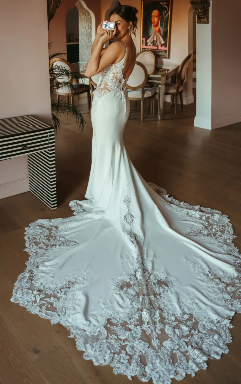 Stella York crepe wedding dress with low back and detailed lace long train