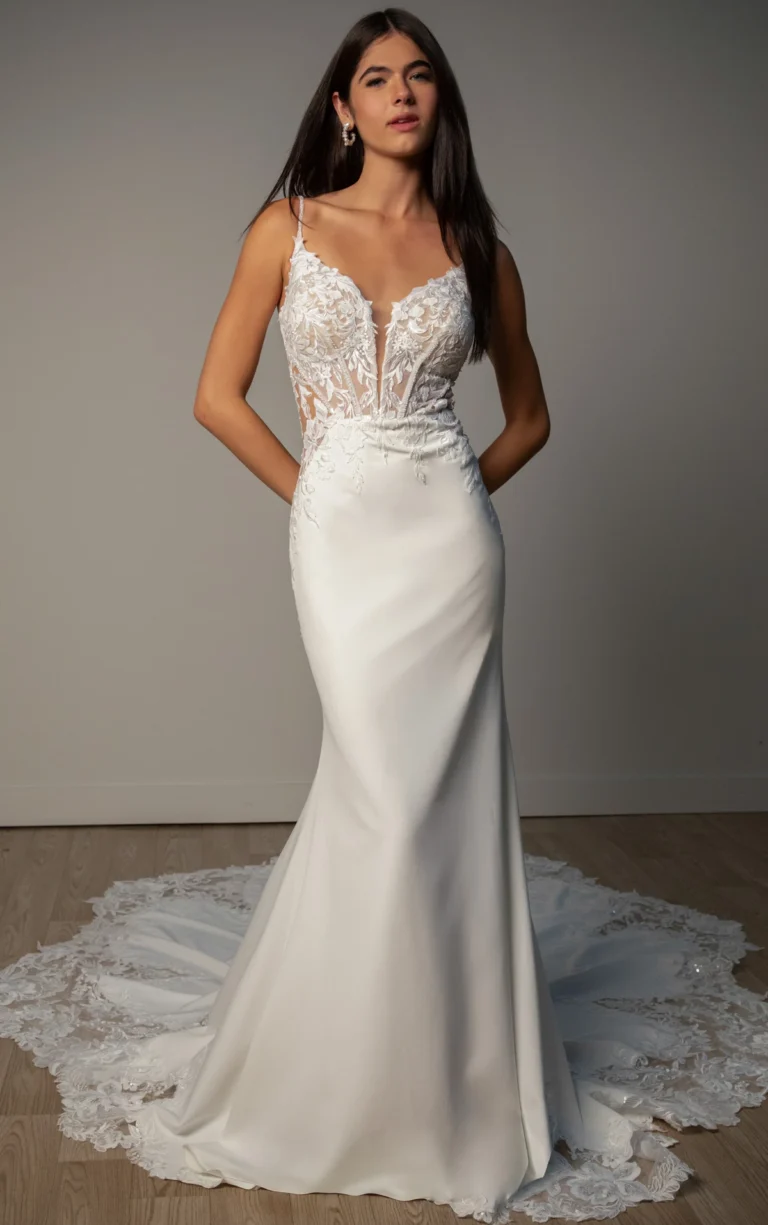 Fitted crepe and lace wedding dress with delicate straps and sheer bodice