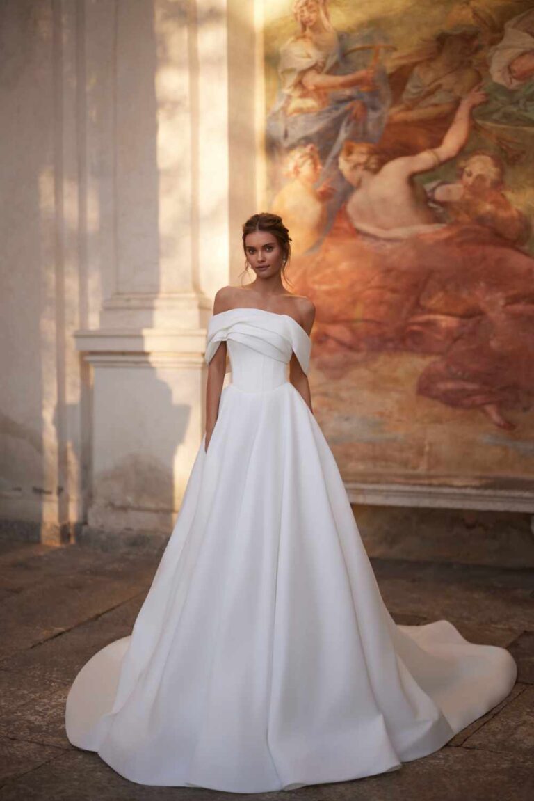 Plain classic ballgown with off the shoulder detail and basque waist.