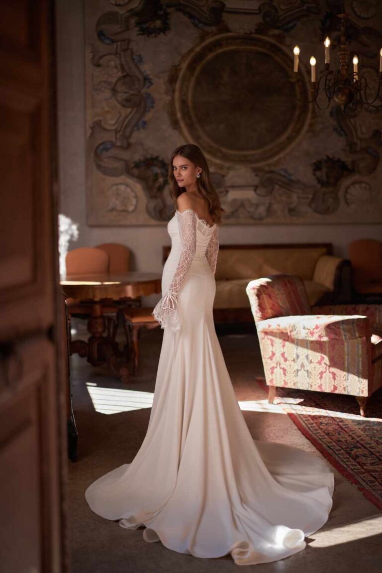 Monet by ivory bridal is now at Wedding Belles of Four. She is a stunning draped crepe satin fitting dress with chantilly long lace sleeves