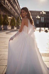 Super stunning ballgown wedding dress called peneople by ivory bridal. Its a satin skirt with a corset basque waist lace detail with pull on gloves.