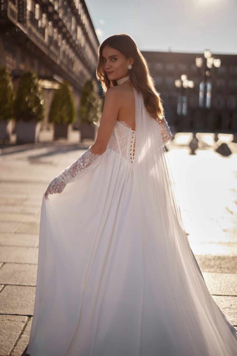 Super stunning ballgown wedding dress called peneople by ivory bridal. Its a satin skirt with a corset basque waist lace detail with pull on gloves.