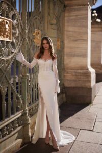 Swan dress being wear with long sleeves with lace and sparkle detail.