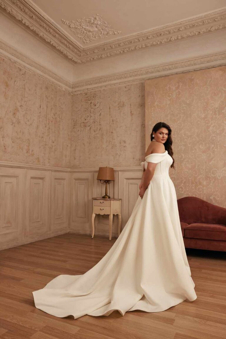 Beautiful brunette plus size curvy Aline classic plain wedding dress corst bodice with split leg by Wedding Belles of Four Oaks