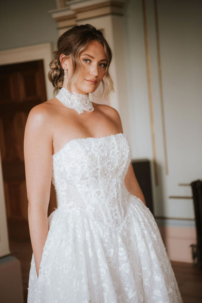 Bellarose by Lottie & Meg from Wedding Belles of Four Oaks Detailed sparkle and pearl lace dramatic ballgown wedding dress with dropped waist basque and straight neckline