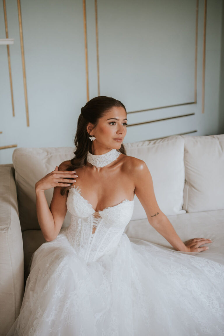 Isabella by Lottie & Meg from Wedding Belles of Four Oaks. This soft a-line chantilly lace and tulle Wedding dress has a dropped waist and plunge neckline