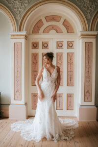 Mischa by Lottie & Meg from Wedding Belles of Four Oaks. This beautiful detailed lace v neck fitted Wedding dress has a sheer bodice and low back