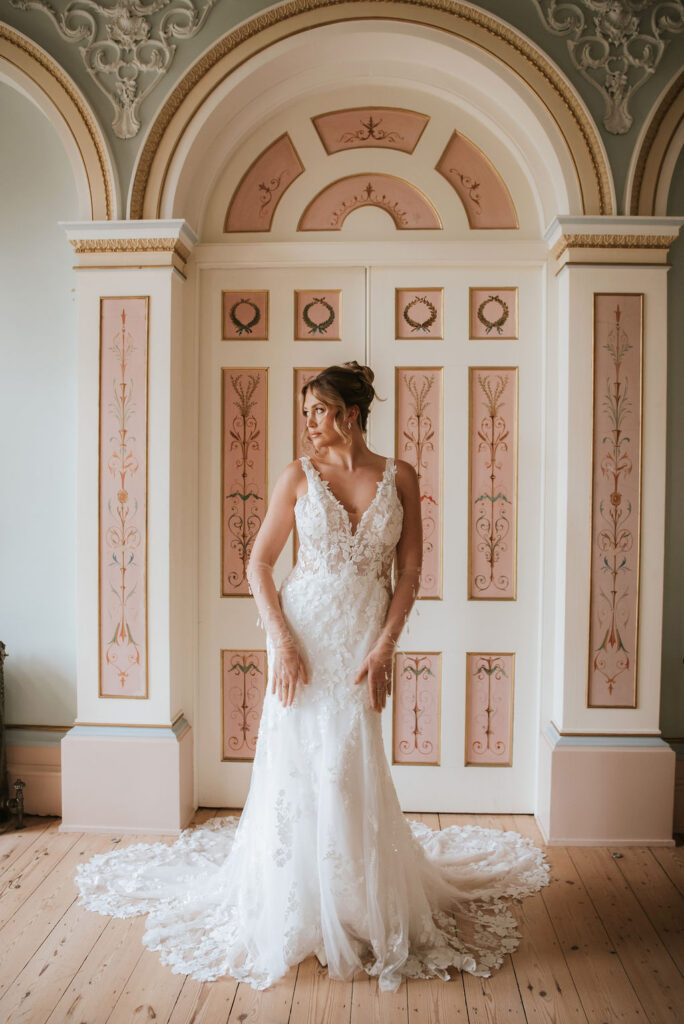 Mischa by Lottie & Meg from Wedding Belles of Four Oaks. This beautiful detailed lace v neck fitted Wedding dress has a sheer bodice and low back